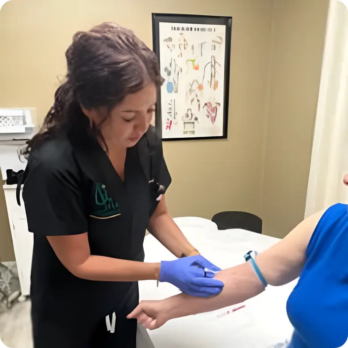 Director of Patient Care Nicole Capobianco, RN conducting a comprehensive in-home regenerative medicine consultation, demonstrating the Alpha Regenesis concierge advantage for residents in exclusive neighborhoods like Port Royal and The Moorings.